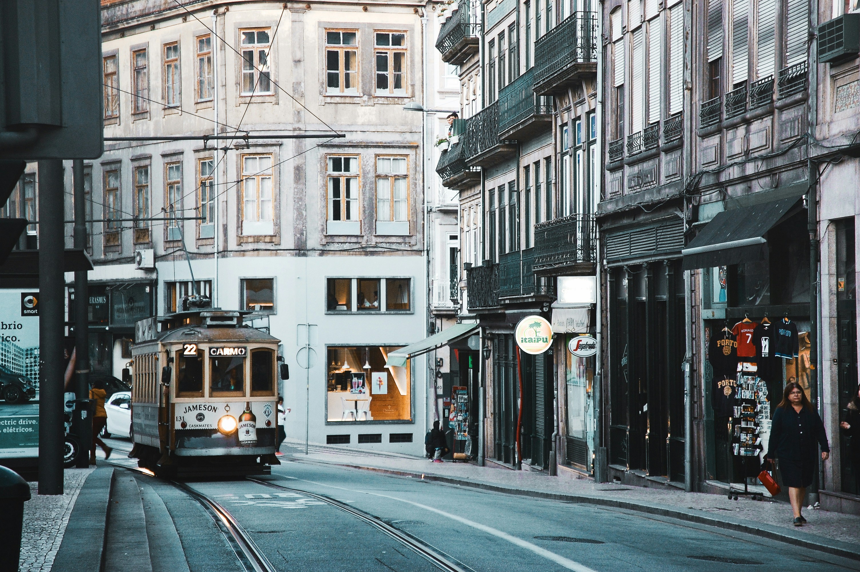 Porto iconic tram on the city streets — explore Porto with our travel guides